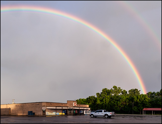 A large double rainbow over the Egolfs IGA Supermarket in the small town of Churubusco, Indiana.