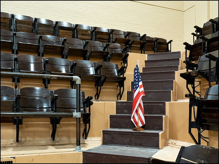 A small American flag stands among the seats in the gymnasium of the GE Club at the former General Electric factory complex in Fort Wayne, Indiana.