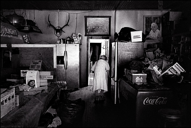 Ninety five year old Mary Mora walks to her home in the back rooms of the bar she owns in Cerrillos, New Mexico.
