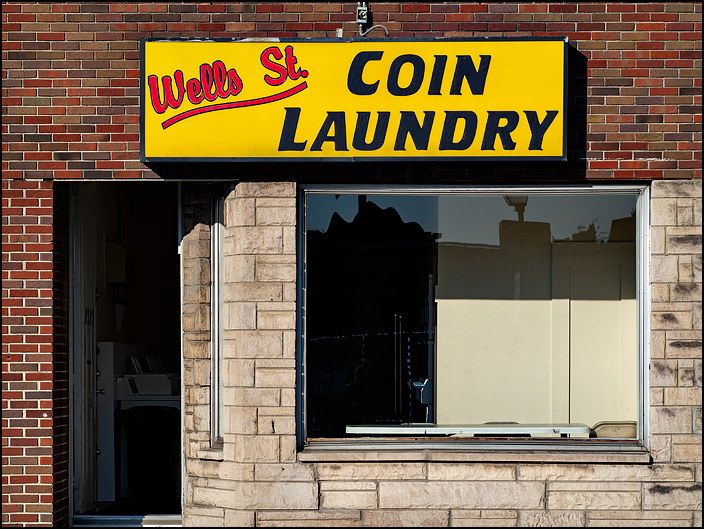 Wells Street Coin Laundry, a laundromat in a tiny brick storefront on Wells Street in Fort Wayne, Indiana.