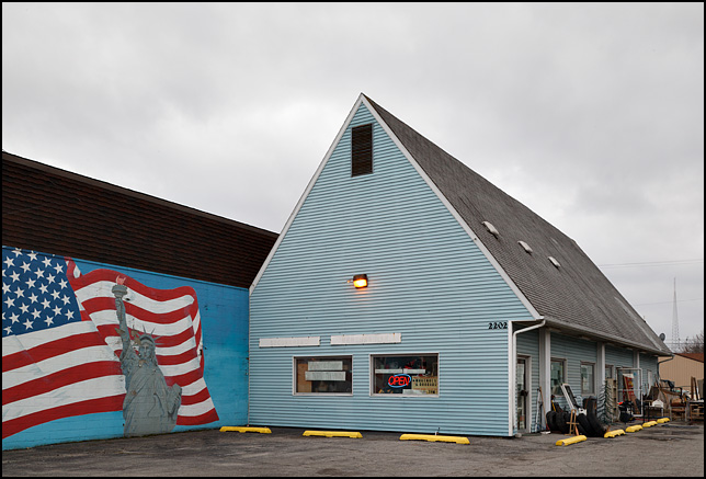 A mural of the Statue of Liberty and an American Flag adorn a wall outside Whutnots and Doodads Secondhand Merchandise on Broadway in Fort Wayne, Indiana.