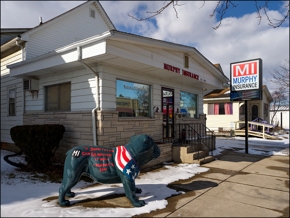 A fiberglass bulldog in front of Murphy Insurance on Broadway in the small town of New Haven, Indiana. The bulldog is painted like the American flag and has Murphys Law painted on it. If something can go wrong it will.