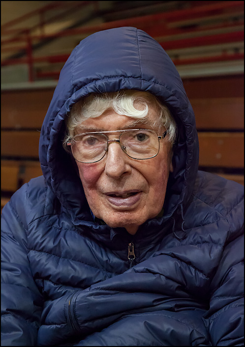 Don Goss, former art teacher at Elmhurst High School in Fort Wayne, Indiana. I photographed him in the school's gym during a final tour of the school before it was demolished. He is wearing a padded jacket because there is no heat in the school.