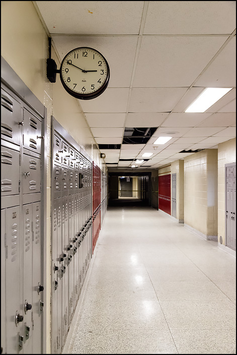 A clock on the wall in the English Department hallway at Elmhurst High School in Fort Wayne, Indiana. The clock, like all of the clocks in the closed school, is stopped at 2:49.