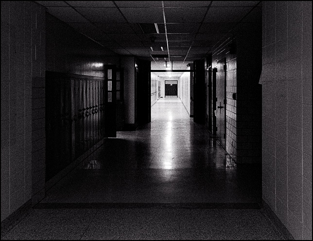A darkened hallway inside the abandoned Elmhurst High School in Fort Wayne.