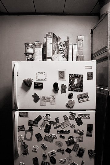 Grandpa's refrigerator covered in souvenir magnets collected by my grandparents.