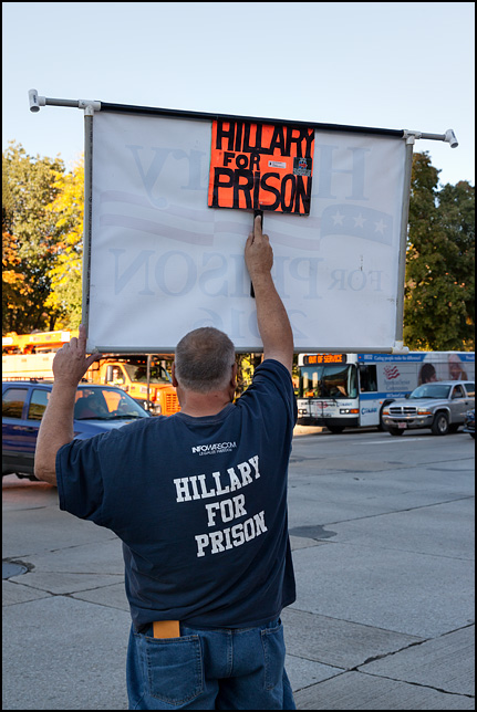 Donald Trump supporter Dan Carroll holding a large Hillary For Prison sign at the intersection of Main Street and Clinton Street in downtown Fort Wayne, Indiana. Dan is wearing a Hillary For Prison 2016 t-shirt.