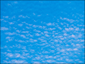 Abstract photographs of round white clouds in a blue July morning sky in Fort Wayne, Indiana.